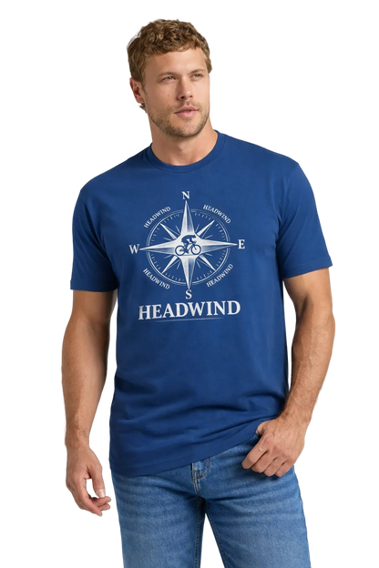 Man wearing a blue t-shirt with 'HEADWIND' design on a light gray background