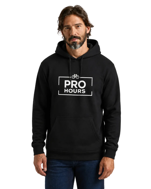 Man wearing a black hoodie with 'PRO HOURS' logo on a gray background