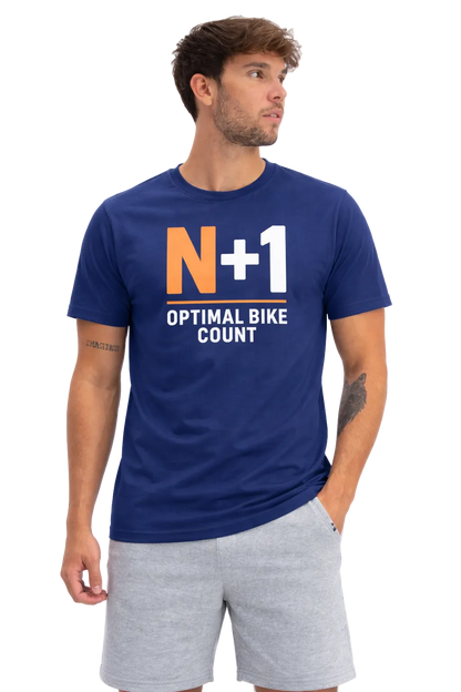 Man wearing a blue t-shirt with 'N+1 Optimal Bike Count' text, standing against a white background