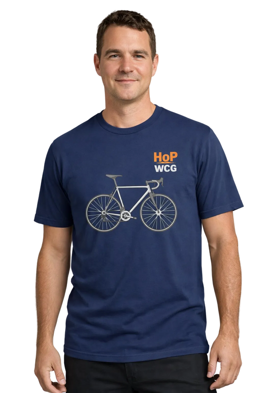 Man wearing a navy blue t-shirt with a bicycle graphic and text on a gray background