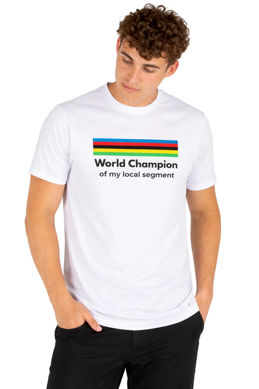 Person wearing a white t-shirt with colorful stripes and text on a plain background