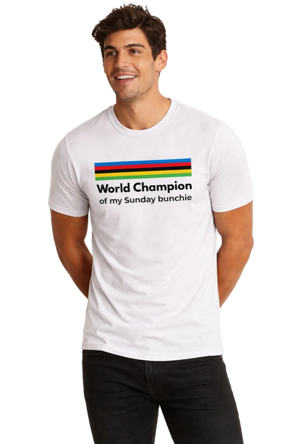 Man wearing a white t-shirt with colorful text design on a plain background