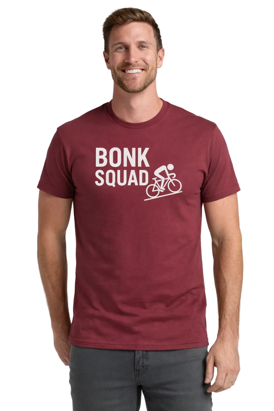 Man wearing a maroon t-shirt with 'Bonk Squad' text and graphic on a light gray background
