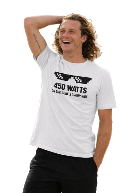 Man wearing a white t-shirt with text "450 watts on the zone 2 group ride"